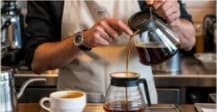 Barista brewing manual pour-over filter coffee